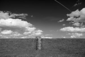 black and white landscape with stairway and clouds