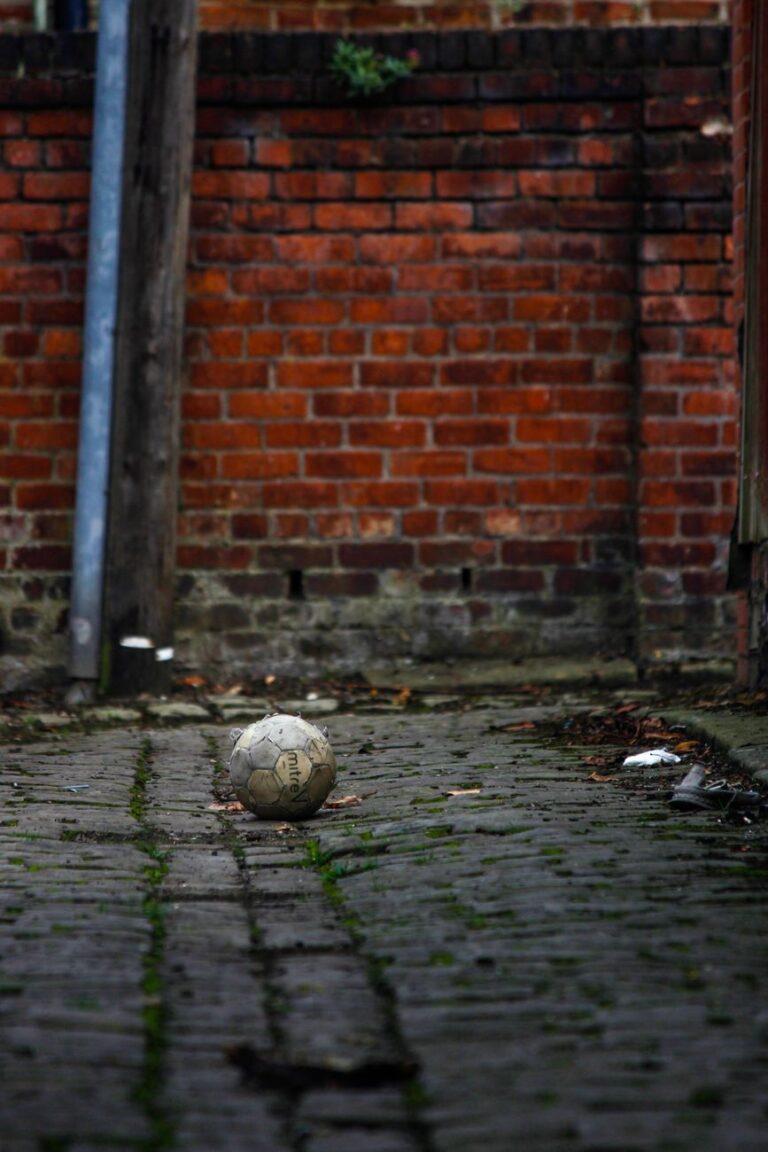 an old soccer ball on the ground