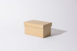 brown cardboard box on white surface