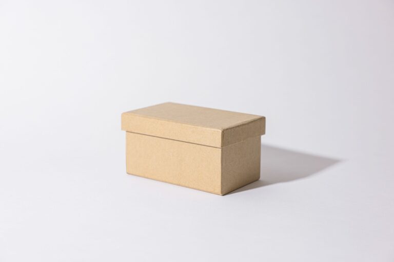brown cardboard box on white surface